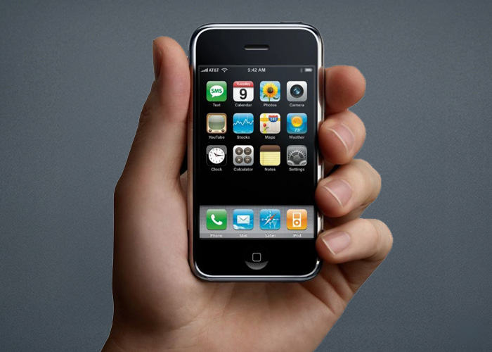 The original iPhone is shown. There are apps on the display.