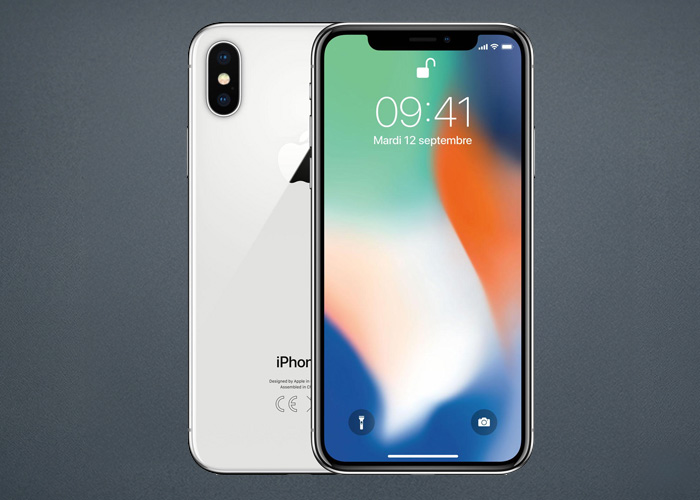 Two iPhone X's are showing with the displaying showing a green, orange, and blue wallpaper on the lock screen.