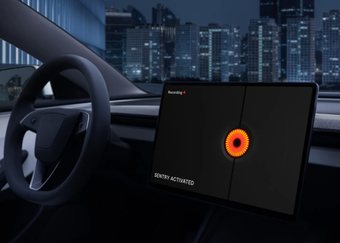 Interior screen of a Tesla showing Sentry Mode with a cityscape in the background 